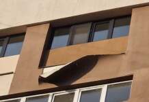 Foto: Cât de prost au fost anvelopate blocurile din Tg-Jiu. Au început să se ”decojească”